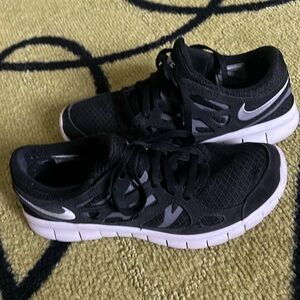 Women’s black Nike free runs